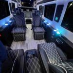 Executive Mercedes Benz Sprinter limo interior with reclining leather seats in NYC