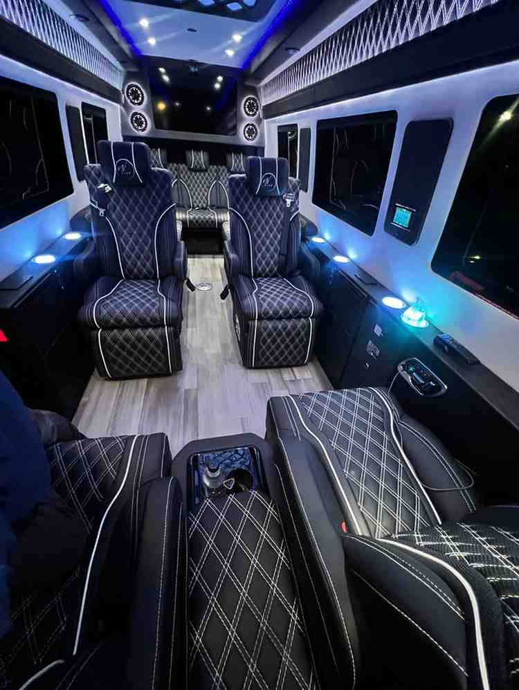 Executive Mercedes Benz Sprinter limo interior with reclining leather seats in NYC