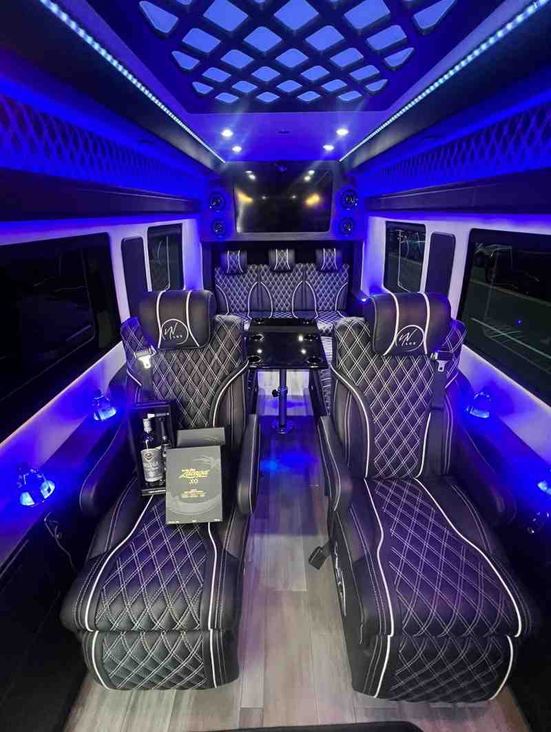 VIP Mercedes Benz Sprinter limo interior with table and luxury seating in New York City