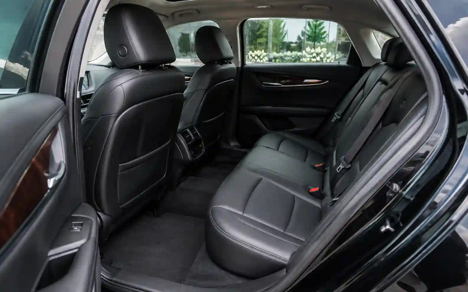 Rear leather passenger seats inside a Cadillac XTS executive sedan