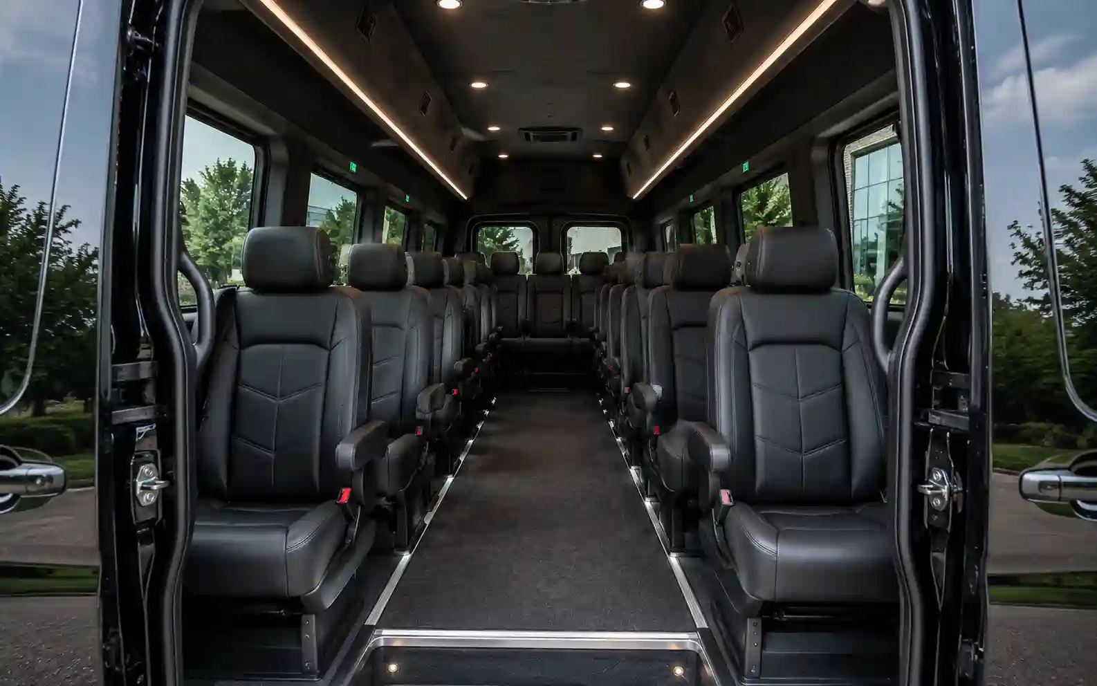 Interior cabin of a Mercedes Benz Sprinter van showing executive seating