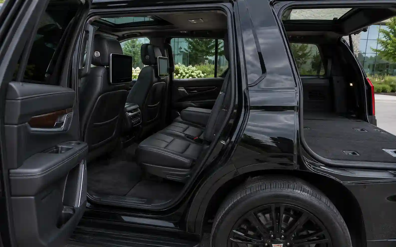 Rear passenger seating inside a Cadillac Escalade luxury SUV
