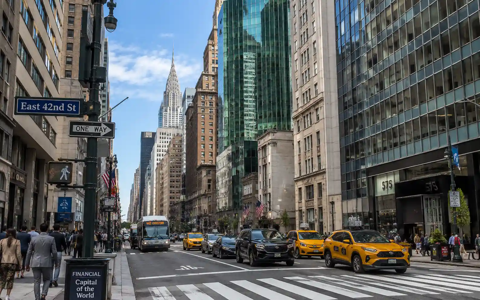 Busy Midtown East avenue in New York lined with tall buildings